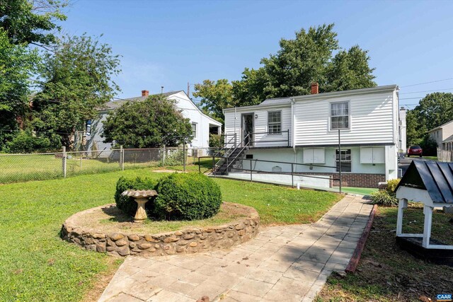 ranch-style house with a front lawn