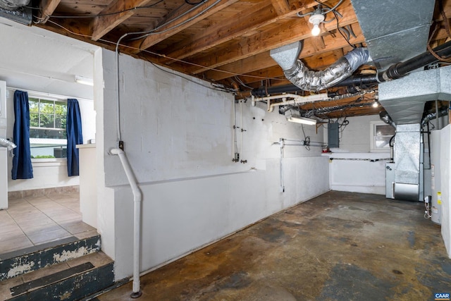 basement with electric panel and heating unit