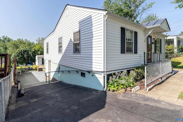 view of side of home with a patio area