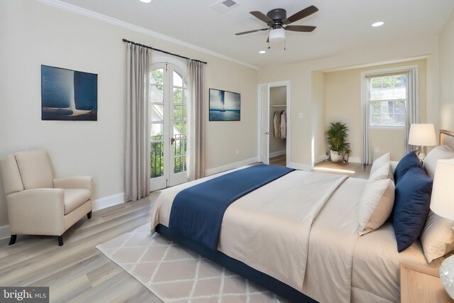 bedroom with crown molding, light wood-type flooring, access to exterior, a closet, and ceiling fan