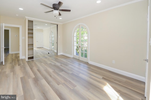 unfurnished bedroom with light hardwood / wood-style floors, ornamental molding, ceiling fan, and a closet