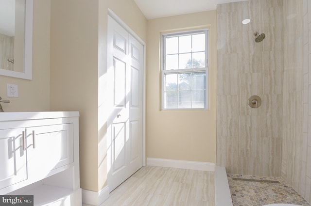 bathroom with tiled shower