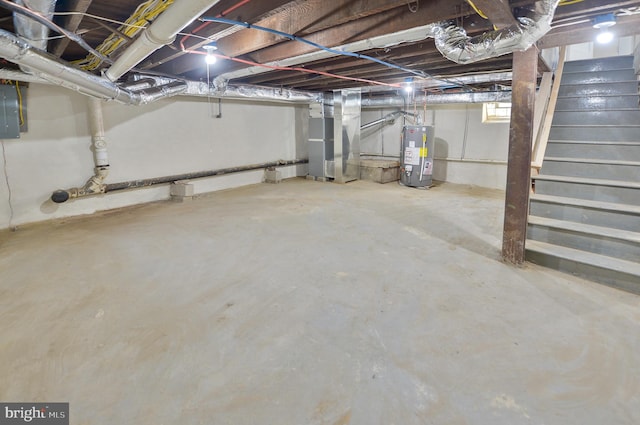 basement featuring water heater and electric panel