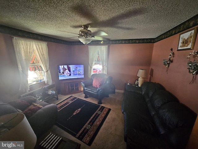 living room featuring a textured ceiling, ceiling fan, and carpet floors