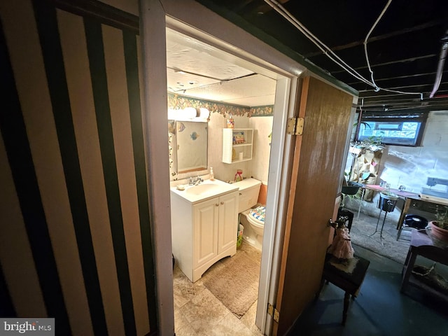 bathroom featuring vanity and toilet