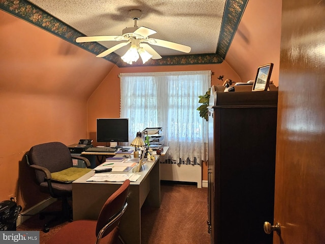 carpeted home office with a textured ceiling, ceiling fan, and lofted ceiling