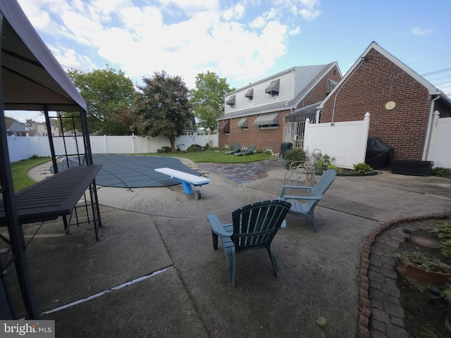 view of pool featuring a lawn and a patio