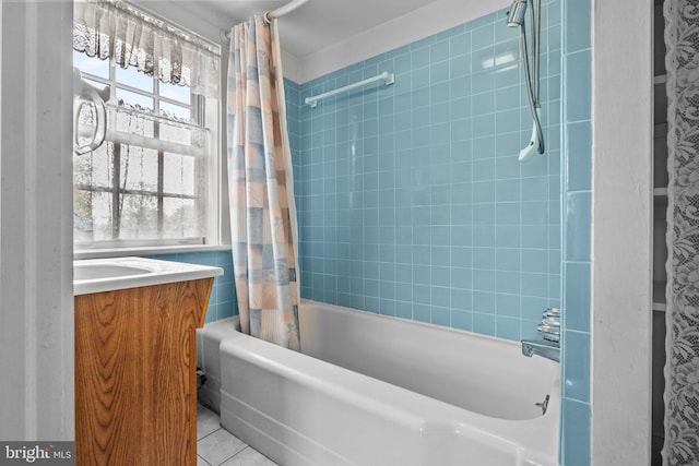 bathroom with tile patterned floors, vanity, and shower / tub combo