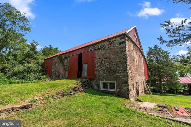 view of property exterior featuring a yard