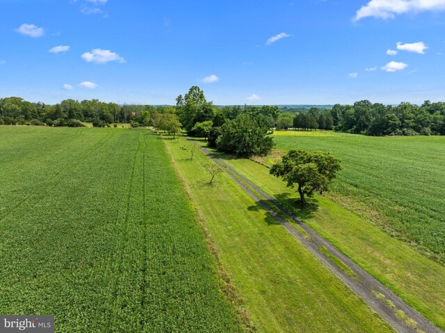 birds eye view of property featuring a rural view