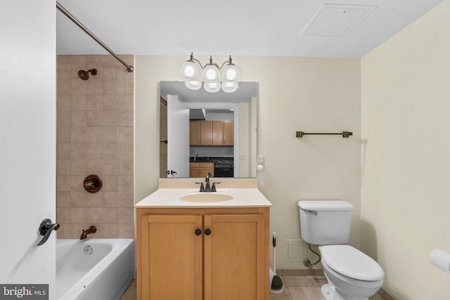 full bathroom with toilet, washtub / shower combination, vanity, tile patterned flooring, and baseboards