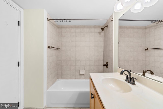 bathroom featuring bathtub / shower combination and vanity