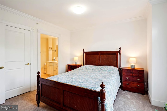 bedroom with light colored carpet, ensuite bath, and crown molding