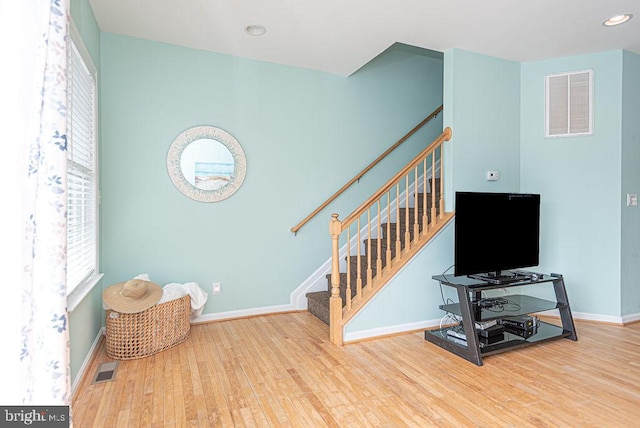 staircase featuring hardwood / wood-style flooring