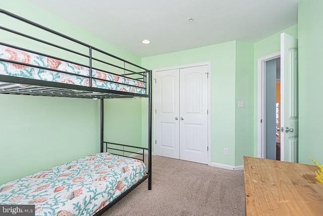 carpeted bedroom with a closet