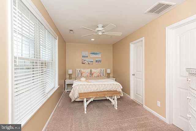 bedroom featuring ceiling fan and carpet