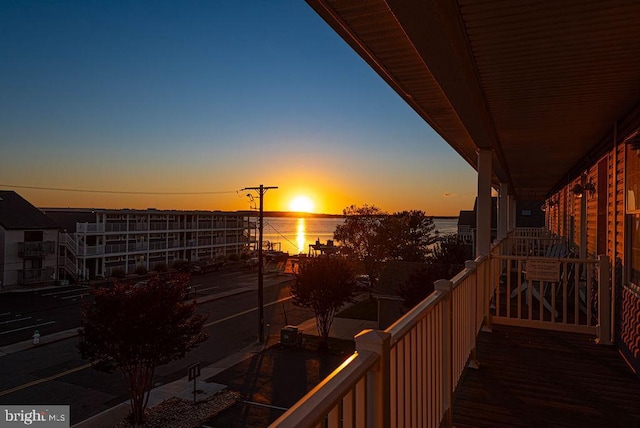 balcony at dusk with a water view