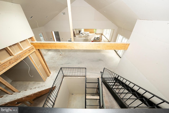 staircase featuring a high ceiling