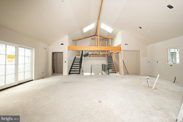 interior space featuring vaulted ceiling with skylight