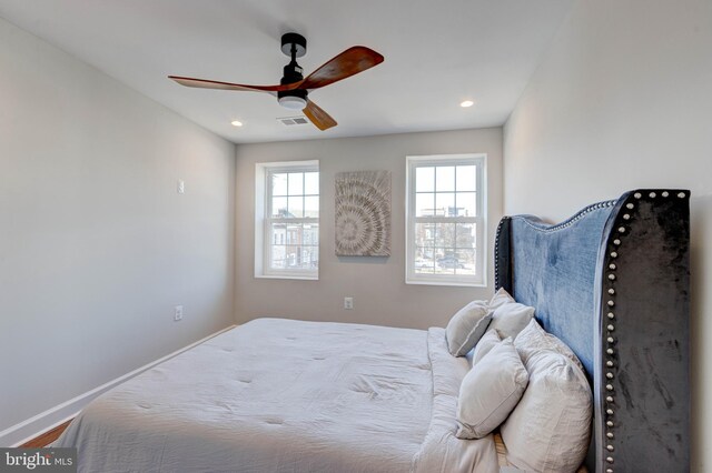 bedroom featuring ceiling fan and wood-type flooring