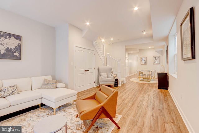 living room with light hardwood / wood-style flooring