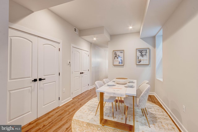 dining space with light wood-type flooring