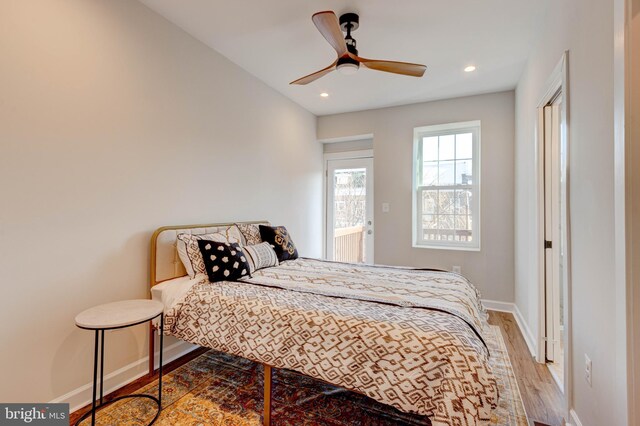 bedroom with ceiling fan and wood-type flooring