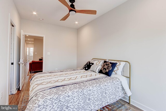 bedroom featuring ceiling fan and wood-type flooring