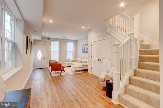 entrance foyer with light wood-type flooring and a wealth of natural light