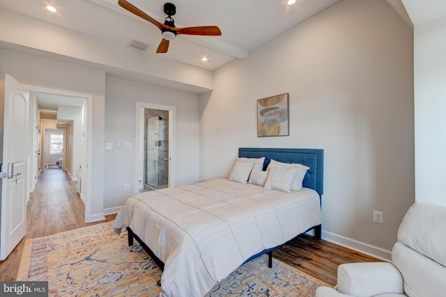 bedroom featuring light wood-type flooring, beamed ceiling, and ceiling fan