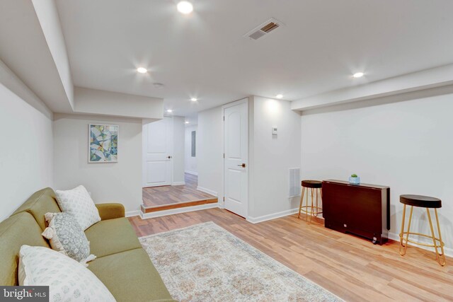 living room with light hardwood / wood-style flooring