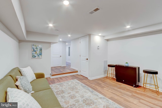 living area featuring hardwood / wood-style floors