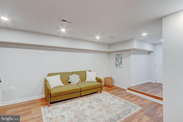 living room with light hardwood / wood-style flooring