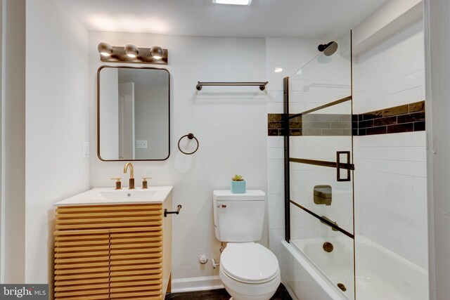 full bathroom featuring toilet, tiled shower / bath combo, and vanity