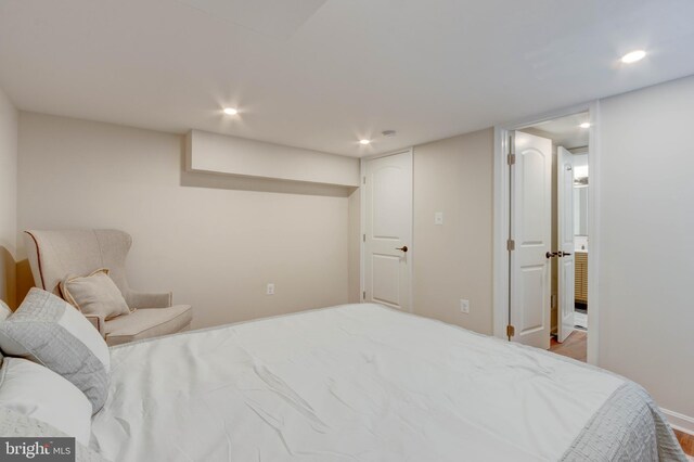 bedroom with hardwood / wood-style flooring