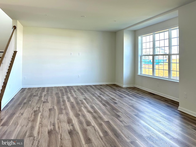 13810 Pulaski Dr Unit 72, Hagerstown, MD 21742 - unfurnished room featuring dark wood-style floors, stairs, and baseboards
