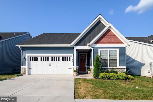 craftsman house featuring driveway, stone siding, and a front yard