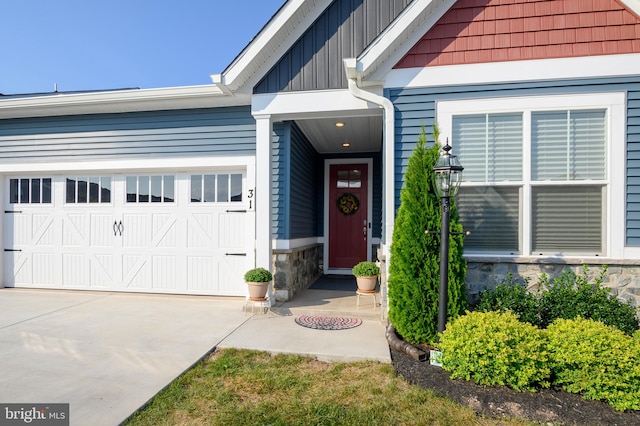 view of exterior entry featuring a garage