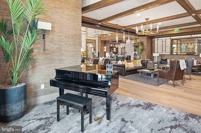 misc room with beamed ceiling, hardwood / wood-style floors, and a notable chandelier