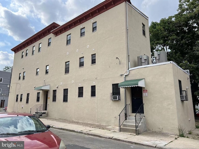 view of building exterior with cooling unit