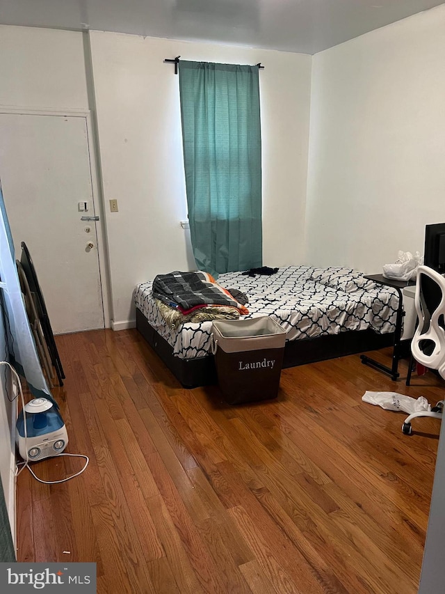 bedroom featuring hardwood / wood-style flooring