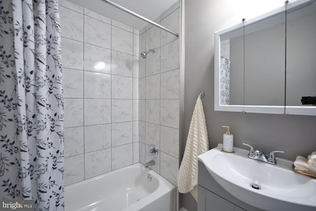 bathroom featuring vanity and shower / bath combination with curtain