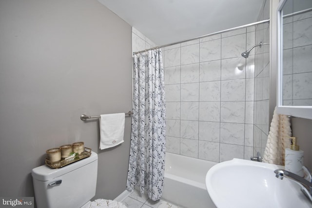 full bathroom featuring shower / tub combo, sink, and toilet