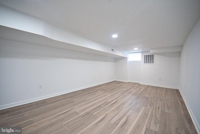 basement featuring wood-type flooring