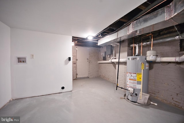 basement with brick wall and gas water heater