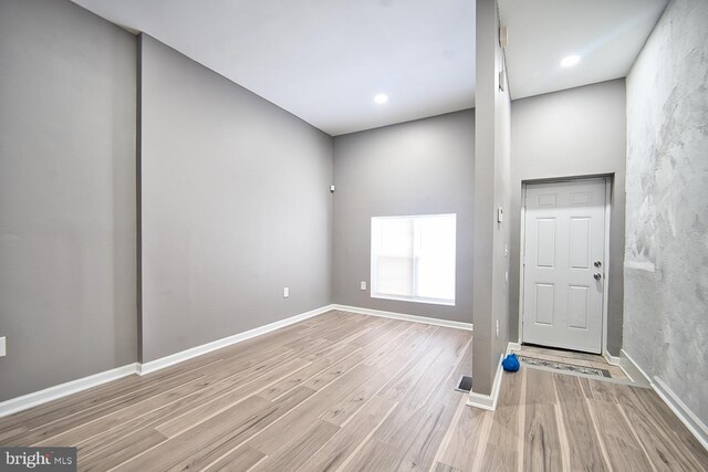 basement with hardwood / wood-style floors