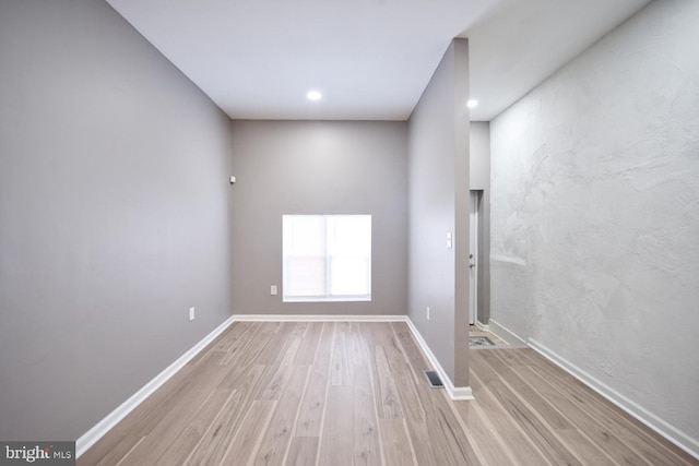 unfurnished room featuring light wood-type flooring