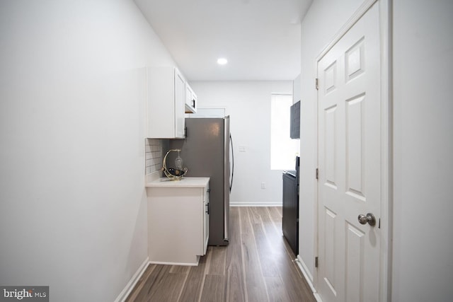 corridor featuring dark hardwood / wood-style flooring