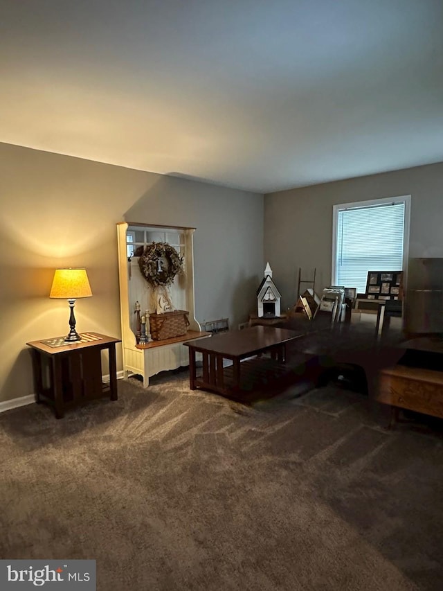 sitting room featuring carpet flooring