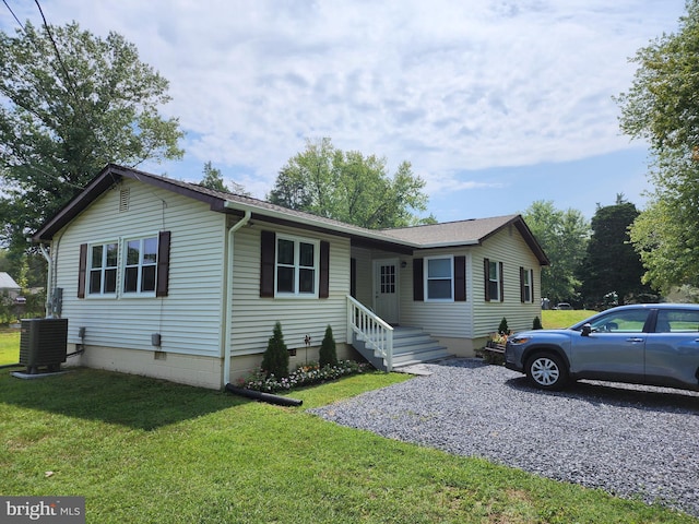 single story home featuring crawl space, central air condition unit, driveway, and a front lawn